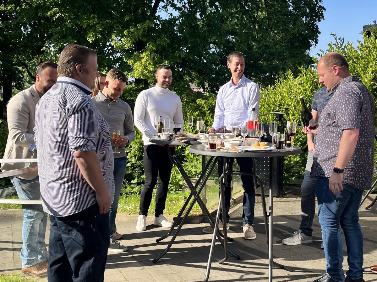 Guests raise their glasses to successful partnerships